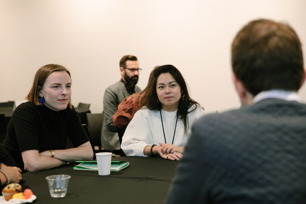People at a roundtable discussion at DesignThinkers Toronto.