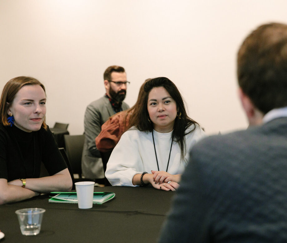People at a roundtable discussion at DesignThinkers Toronto.